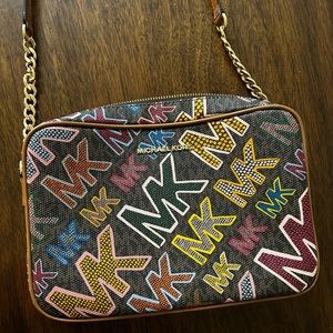 Michael Kors Multi color Monogram cross body.